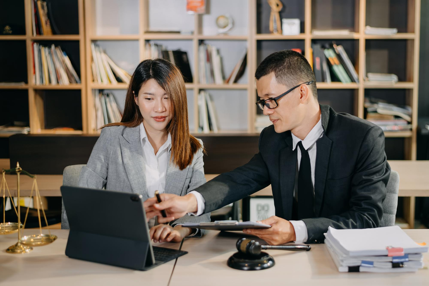 asian-business-team-and-lawyers-discussing-contract-papers-sitting-at-the-table-concepts-of-law-advice-legal-services-at-office